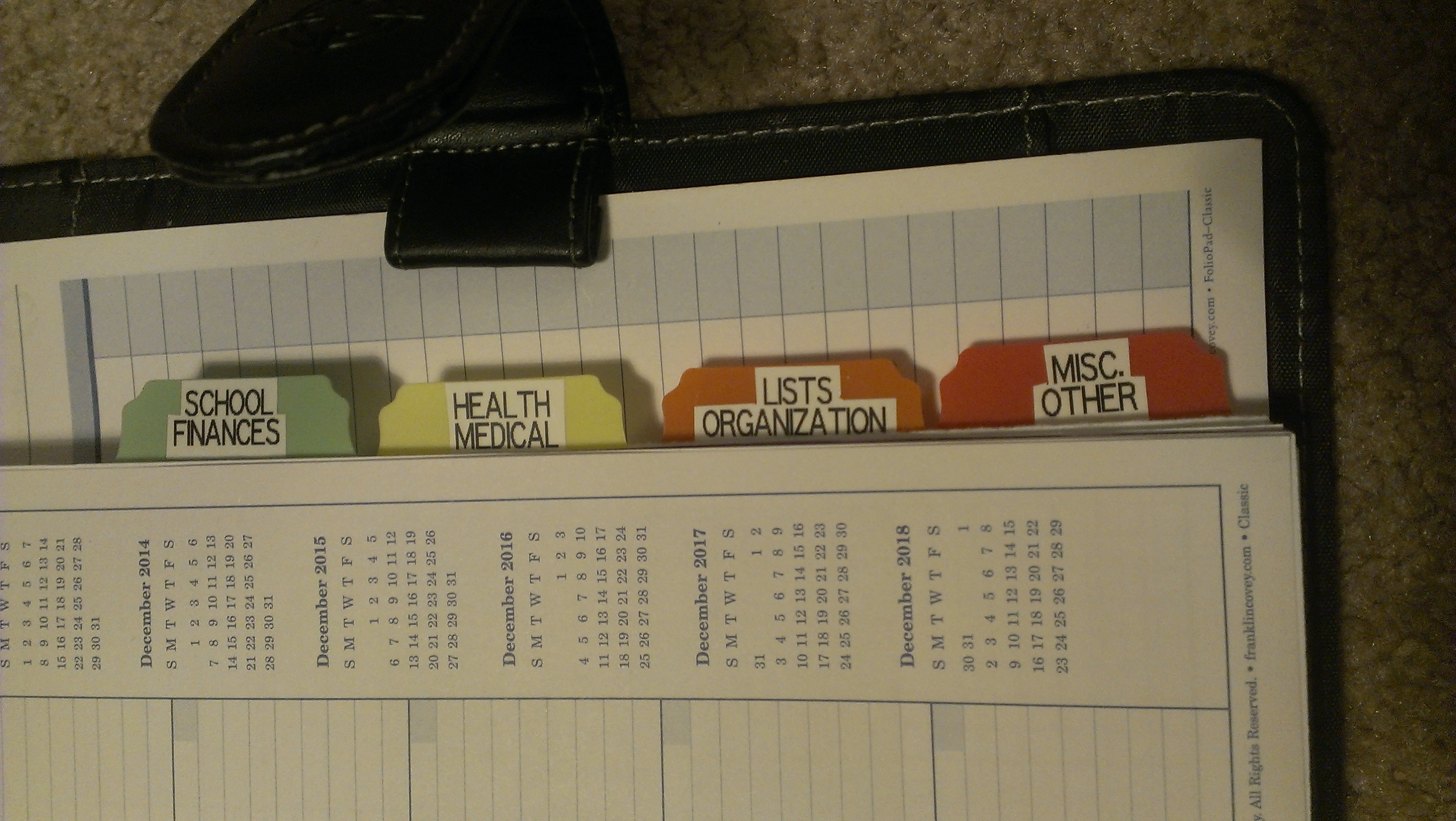 Theresa customizes her Franklin Covey Planner by making her own tabs